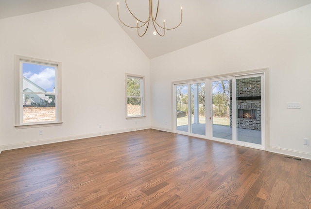 1709 Martha Washington Way, Murfreesboro, TN 37130 - empty room with high vaulted ceiling, a chandelier, dark wood-type flooring, and baseboards