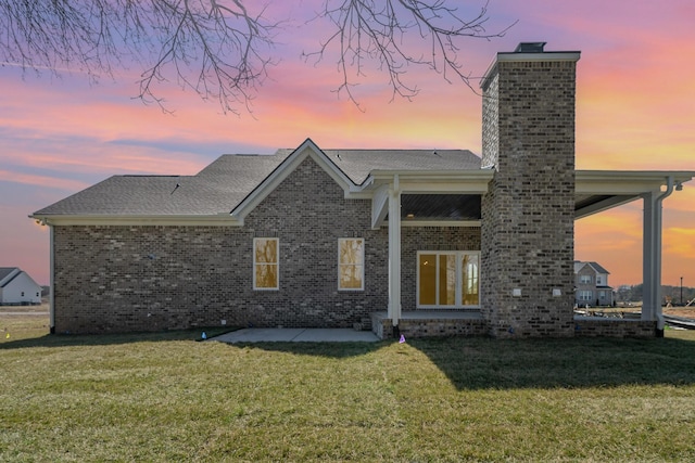 1709 Martha Washington Way, Murfreesboro, TN 37130 - view of front of home with a chimney, a front lawn, and brick siding