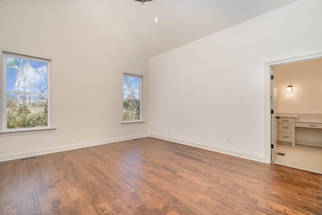 1709 Martha Washington Way, Murfreesboro, TN 37130 - unfurnished bedroom featuring high vaulted ceiling, wood finished floors, and baseboards