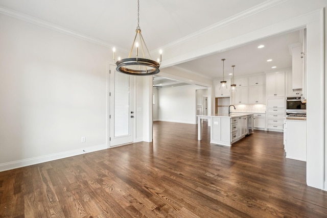 1900 Martha Washington Way, Murfreesboro, TN 37130 - unfurnished living room with a chandelier, baseboards, dark wood finished floors, a sink, and ornamental molding