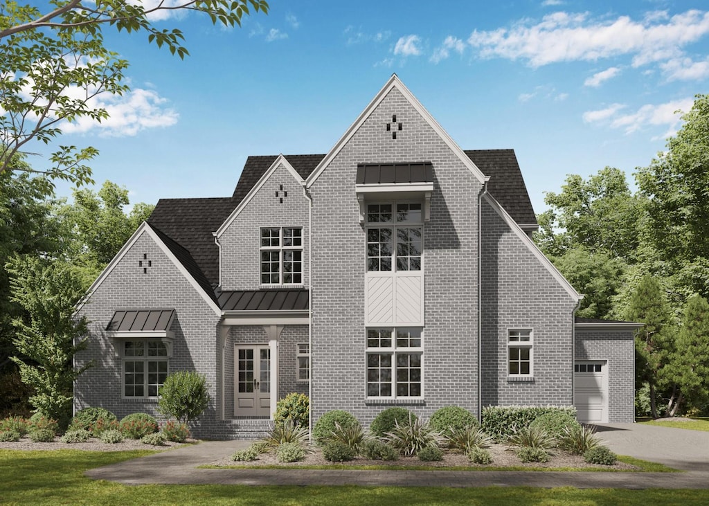4605 Pat Nixon Ct, Murfreesboro, TN 37130 - view of front of house featuring a standing seam roof, brick siding, an attached garage, and metal roof
