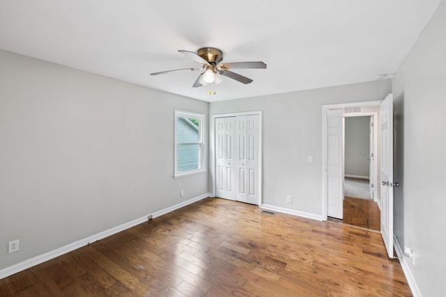932 Circle Dr, Springfield, TN 37172 - unfurnished bedroom featuring wood finished floors, baseboards, a closet, and a ceiling fan