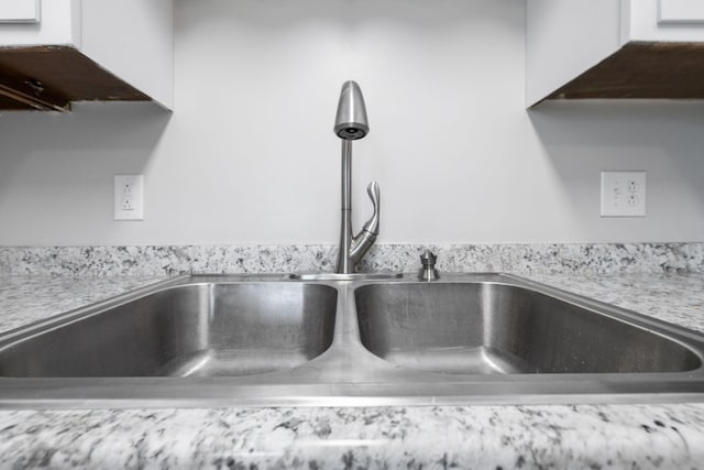 932 Circle Dr, Springfield, TN 37172 - kitchen view of a sink, light countertops, and white cabinetry