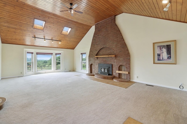 1361 Madison Creek Rd, Goodlettsville, TN 37072 - unfurnished living room featuring wooden ceiling, carpet, a ceiling fan, a fireplace, and high vaulted ceiling
