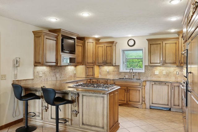 1361 Madison Creek Rd, Goodlettsville, TN 37072 - kitchen with appliances with stainless steel finishes, a peninsula, light tile patterned floors, decorative backsplash, and recessed lighting