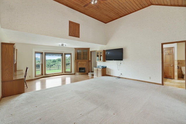 1361 Madison Creek Rd, Goodlettsville, TN 37072 - unfurnished living room with wooden ceiling, a fireplace with raised hearth, ceiling fan, and high vaulted ceiling
