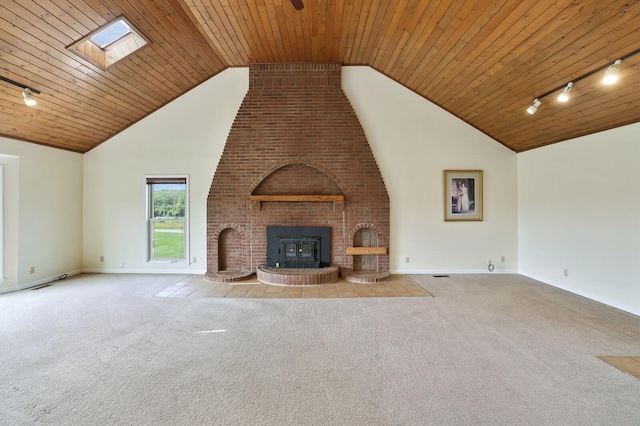 1361 Madison Creek Rd, Goodlettsville, TN 37072 - unfurnished living room featuring track lighting, carpet, a fireplace, lofted ceiling, and wood ceiling