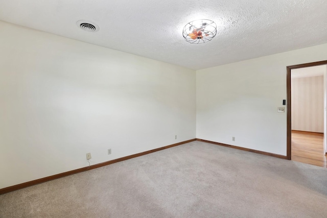 1361 Madison Creek Rd, Goodlettsville, TN 37072 - spare room with light colored carpet and a textured ceiling
