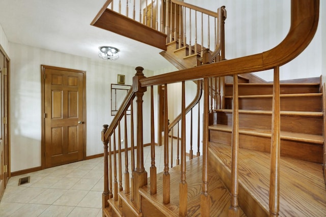 1361 Madison Creek Rd, Goodlettsville, TN 37072 - stairs featuring tile patterned flooring and wallpapered walls