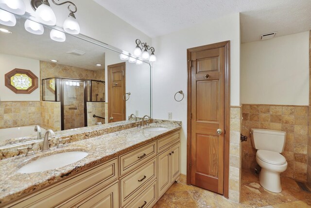 1361 Madison Creek Rd, Goodlettsville, TN 37072 - full bath with a stall shower, double vanity, tile walls, a bath, and wainscoting