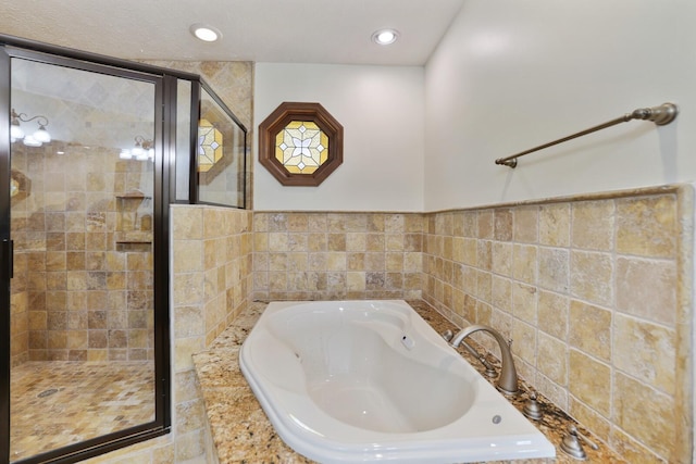 1361 Madison Creek Rd, Goodlettsville, TN 37072 - full bathroom featuring a garden tub, a shower stall, recessed lighting, and tile walls