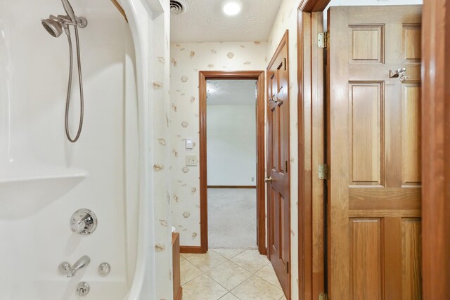 1361 Madison Creek Rd, Goodlettsville, TN 37072 - bathroom with wallpapered walls, shower / bath combination with curtain, tile patterned flooring, and a textured ceiling