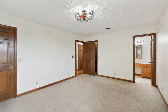 1361 Madison Creek Rd, Goodlettsville, TN 37072 - unfurnished bedroom with light colored carpet, a textured ceiling, and ensuite bath