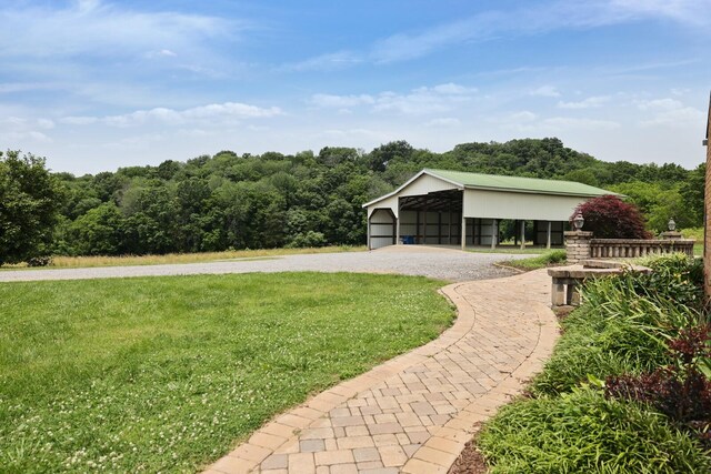 1361 Madison Creek Rd, Goodlettsville, TN 37072 - view of grassy yard featuring a detached carport and driveway