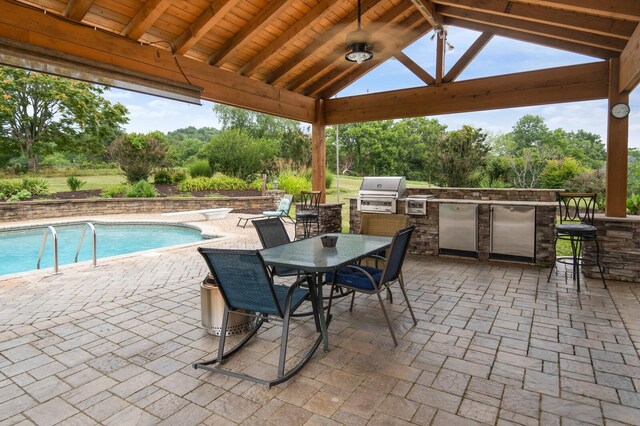 1361 Madison Creek Rd, Goodlettsville, TN 37072 - view of patio featuring exterior kitchen, a gazebo, a bar, an outdoor pool, and outdoor dining area