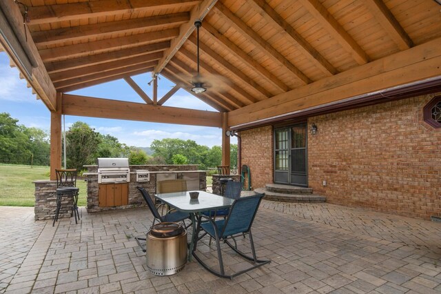 1361 Madison Creek Rd, Goodlettsville, TN 37072 - view of patio with exterior kitchen, a gazebo, a ceiling fan, and outdoor dining space