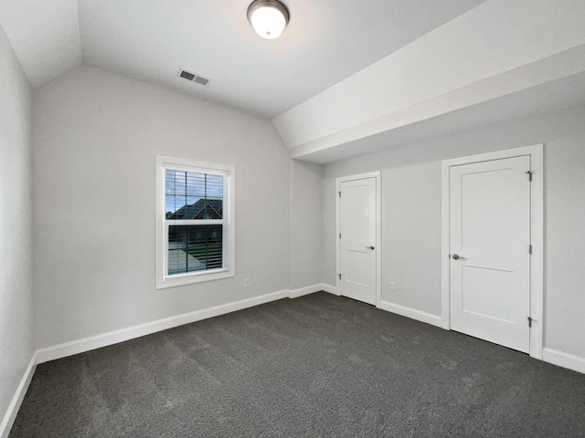 1117 Bandini Ct, Lascassas, TN 37085 - bonus room with vaulted ceiling, dark colored carpet, and baseboards