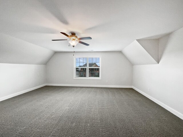 1117 Bandini Ct, Lascassas, TN 37085 - additional living space with baseboards, vaulted ceiling, dark colored carpet, and a ceiling fan
