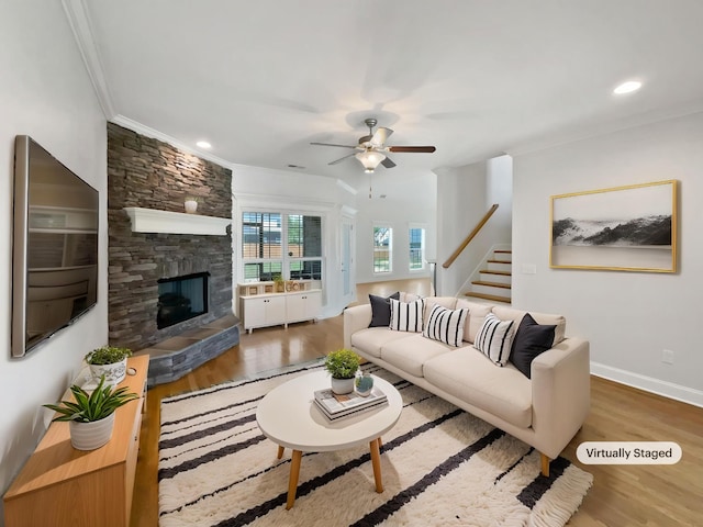 1117 Bandini Ct, Lascassas, TN 37085 - living area with ornamental molding, wood finished floors, ceiling fan, stairs, and baseboards