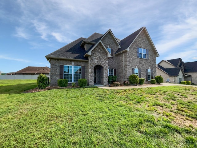 1117 Bandini Ct, Lascassas, TN 37085 - view of front of house featuring a front lawn, brick siding, and roof with shingles