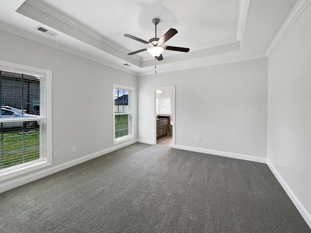 1117 Bandini Ct, Lascassas, TN 37085 - unfurnished room with a raised ceiling, crown molding, dark carpet, ceiling fan, and baseboards