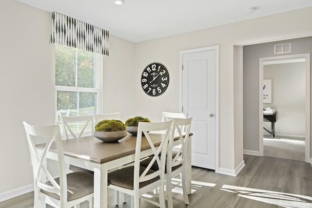 dining room with wood finished floors and baseboards