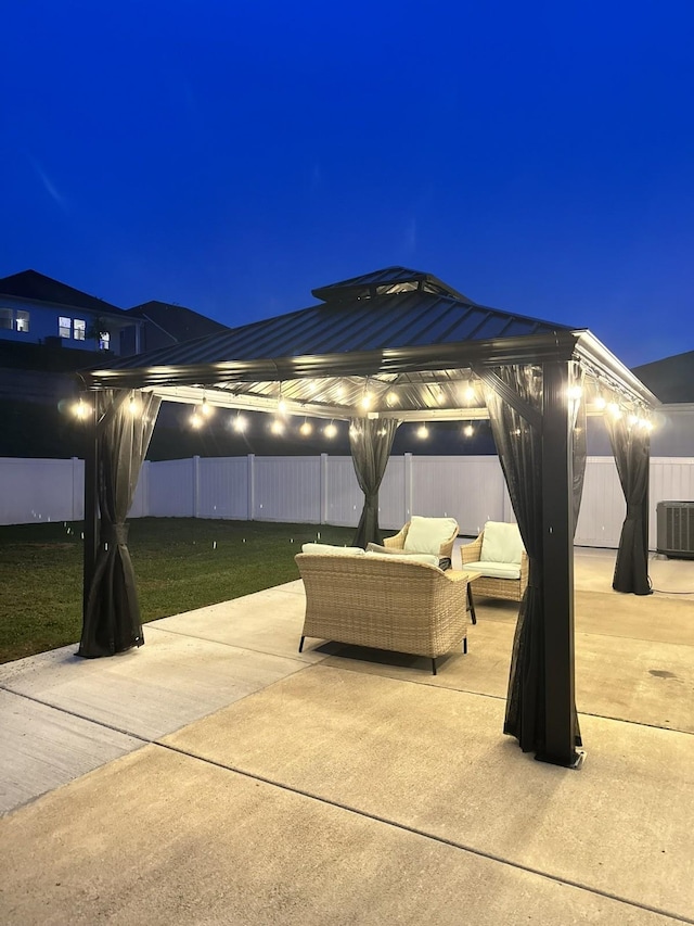 1063 Holland Ridge Way, Lebanon, TN 37090 - patio at night with a gazebo, an outdoor hangout area, and cooling unit