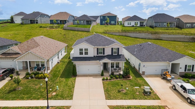 1063 Holland Ridge Way, Lebanon, TN 37090 - traditional-style home with a residential view, concrete driveway, and covered porch