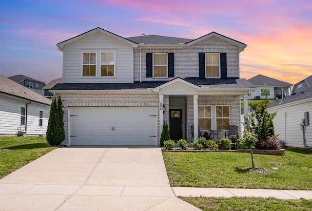 1063 Holland Ridge Way, Lebanon, TN 37090 - traditional-style home featuring a front lawn, a porch, brick siding, driveway, and a garage