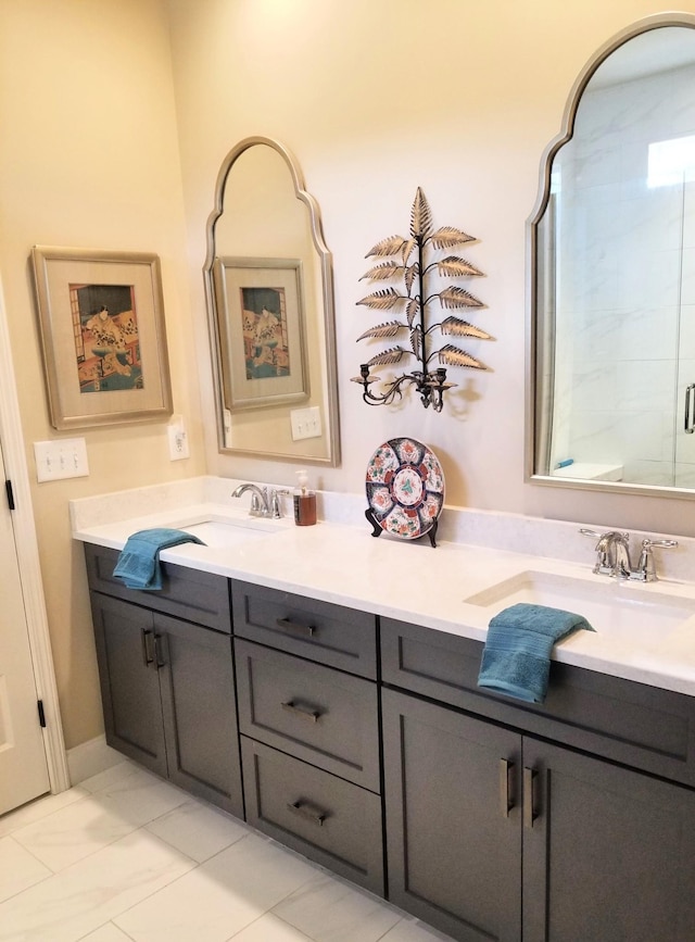 501 Wright Branch Cv, Hermitage, TN 37076 - bathroom featuring double vanity, marble finish floors, and a shower with door