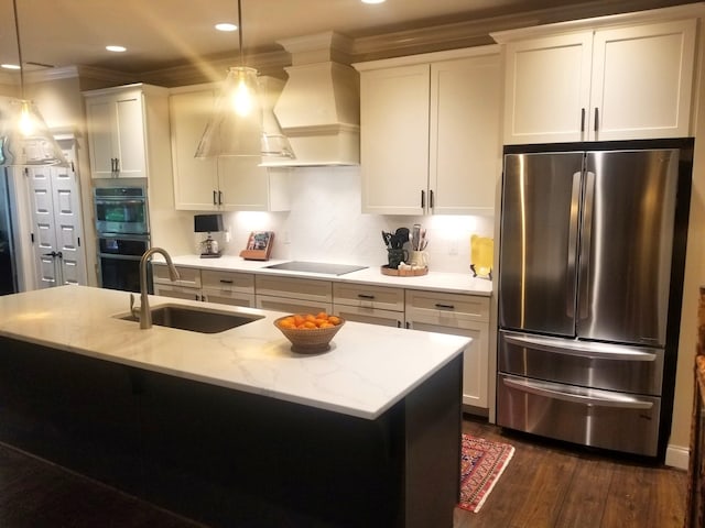 501 Wright Branch Cv, Hermitage, TN 37076 - kitchen with appliances with stainless steel finishes, a sink, dark wood-style floors, ornamental molding, and hanging light fixtures