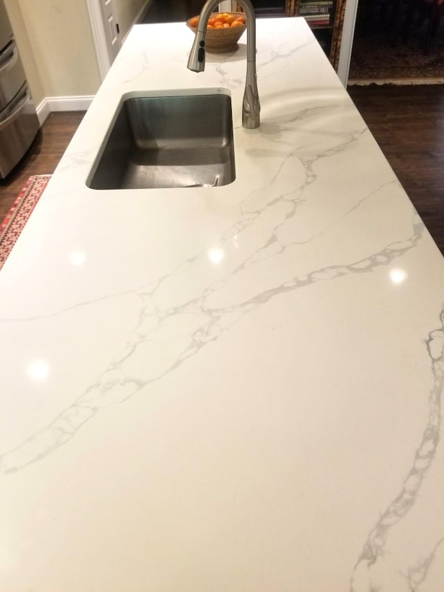 501 Wright Branch Cv, Hermitage, TN 37076 - kitchen view of a sink, light stone countertops, and dark wood-type flooring