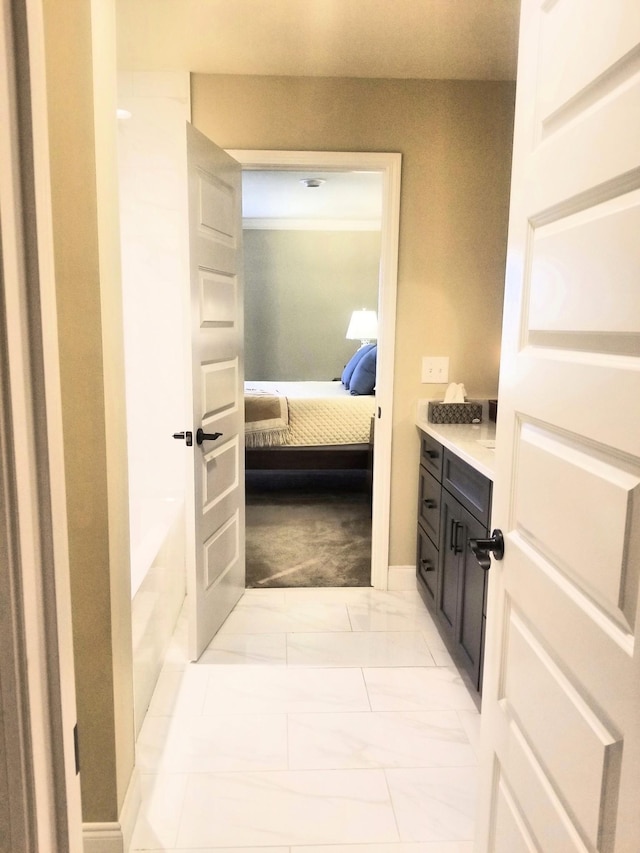 501 Wright Branch Cv, Hermitage, TN 37076 - bathroom with ensuite bathroom, vanity, a bath, marble finish floors, and baseboards