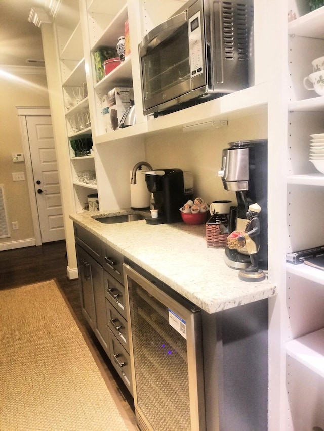 501 Wright Branch Cv, Hermitage, TN 37076 - kitchen with stainless steel microwave, a sink, beverage cooler, dark wood-type flooring, and open shelves