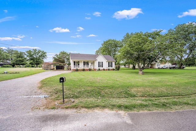 104 Pierce Pl, Unionville, TN 37180 - ranch-style house with a detached carport, covered porch, a front lawn, and driveway