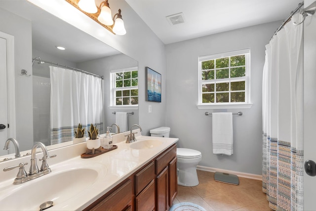 full bathroom with toilet, tile patterned flooring, double vanity, baseboards, and a shower with shower curtain