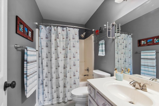 full bathroom featuring toilet, shower / bath combo with shower curtain, and vanity
