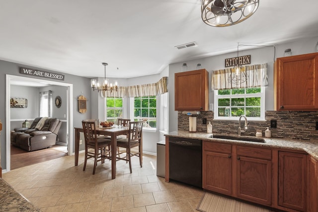 kitchen with black dishwasher, a sink, a chandelier, and plenty of natural light
