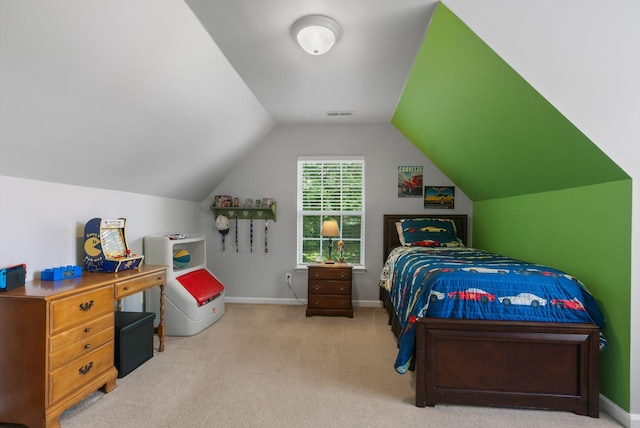 bedroom with carpet flooring, lofted ceiling, and baseboards