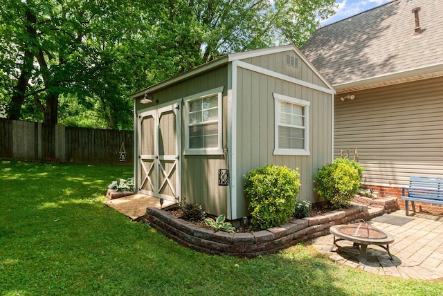 view of shed featuring a fire pit