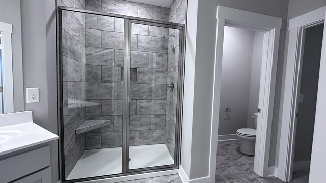 3514 Firerock Dr, Murfreesboro, TN 37128 - bathroom featuring a stall shower, marble finish floors, baseboards, toilet, and vanity