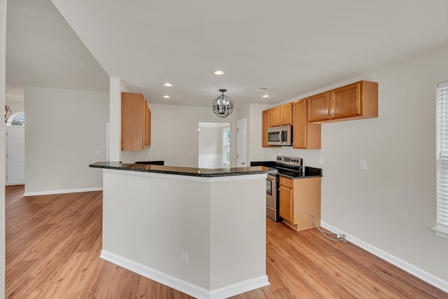 4725 Cape Hope Pass, Hermitage, TN 37076 - kitchen featuring stainless steel appliances, dark countertops, light wood-style floors, recessed lighting, and baseboards