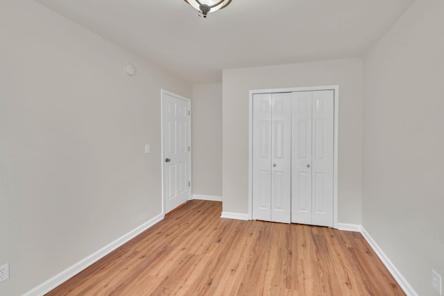 4725 Cape Hope Pass, Hermitage, TN 37076 - unfurnished bedroom with light wood-style floors, baseboards, and a closet