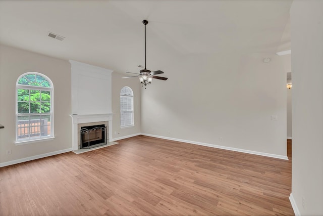 4725 Cape Hope Pass, Hermitage, TN 37076 - unfurnished living room with light wood finished floors, a ceiling fan, baseboards, and a high end fireplace