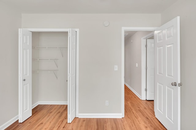 4725 Cape Hope Pass, Hermitage, TN 37076 - unfurnished bedroom featuring light wood finished floors, a closet, and baseboards