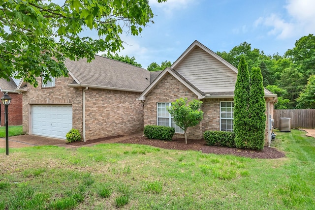 4725 Cape Hope Pass, Hermitage, TN 37076 - view of front facade featuring central AC, brick siding, roof with shingles, an attached garage, and driveway