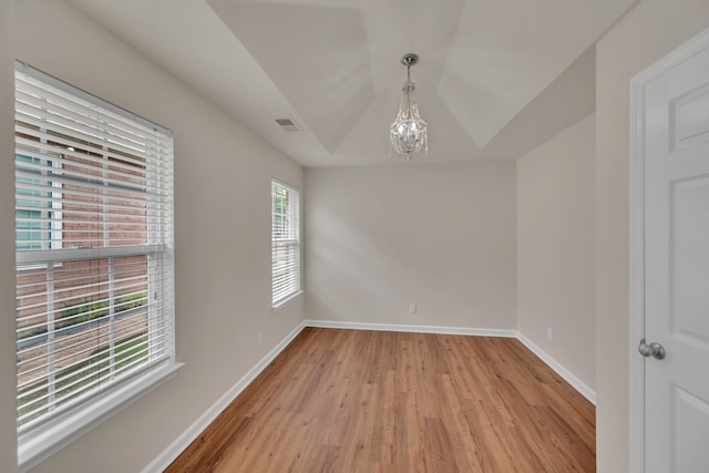 4725 Cape Hope Pass, Hermitage, TN 37076 - spare room featuring a chandelier, light wood-style floors, and baseboards