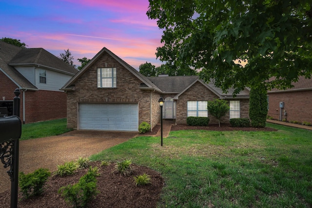 4725 Cape Hope Pass, Hermitage, TN 37076 - traditional-style home featuring an attached garage, driveway, brick siding, and a front lawn