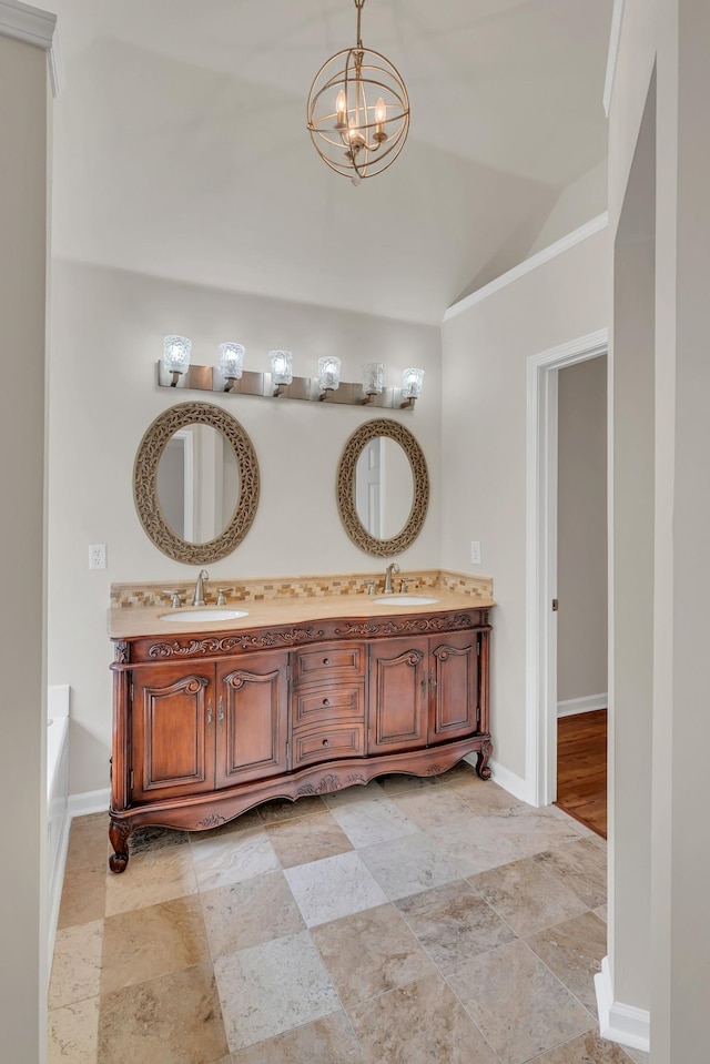 4725 Cape Hope Pass, Hermitage, TN 37076 - bathroom with lofted ceiling, double vanity, baseboards, a chandelier, and a tub to relax in