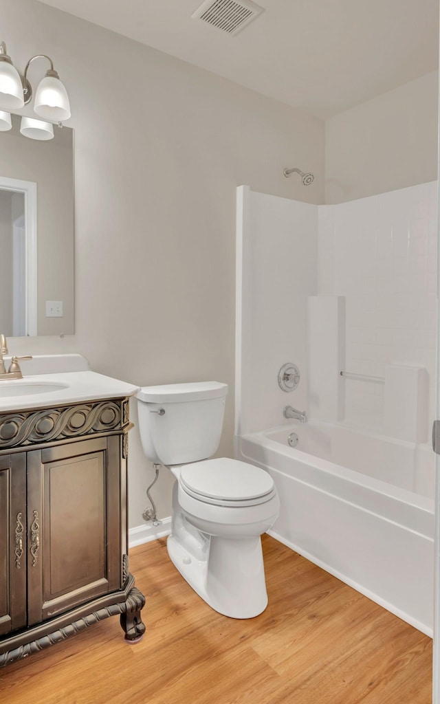 4725 Cape Hope Pass, Hermitage, TN 37076 - full bathroom featuring wood finished floors, toilet, vanity, and washtub / shower combination